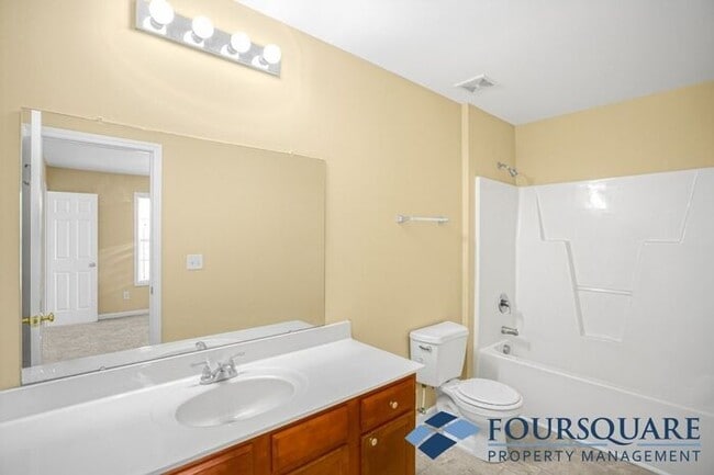 Building Photo - Charming 3-Bedroom Townhome with First-Floor Suite & Off-Street Parking – Near Capital Blvd & I-440