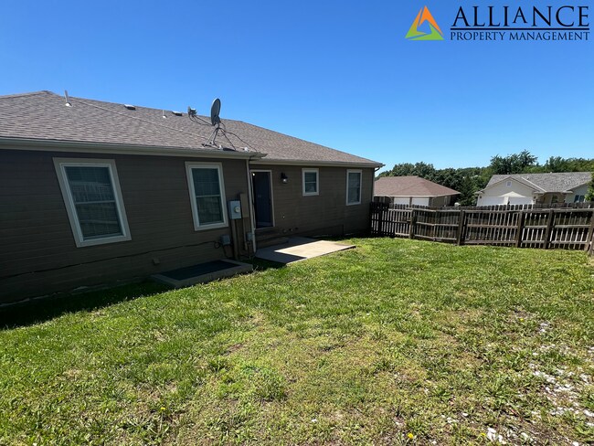 Building Photo - NEWLY PAINTED! Walk Out Basement & Much, Much More!