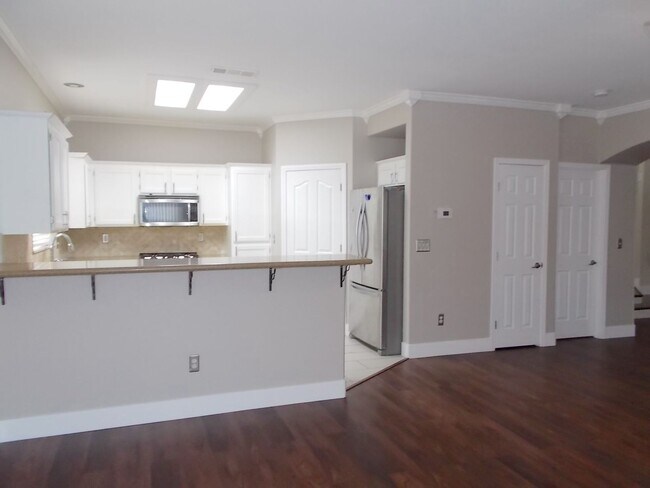 Building Photo - Spacious 4-Bedroom Home with Pool & 3-Car ...