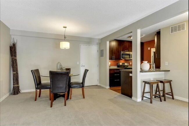 Building Photo - 1Bd/1Ba with Heated Parking, Stainless Steel Appliances, and Pool Access