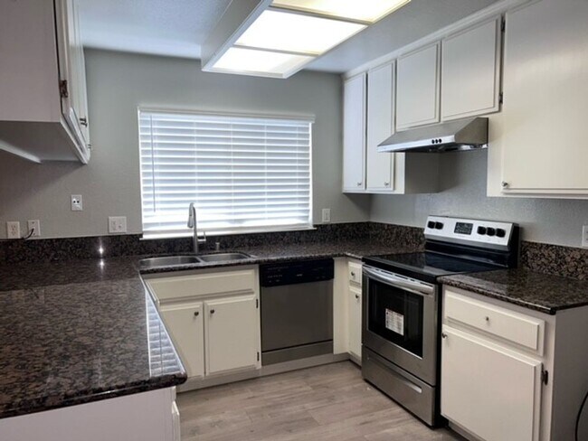 Building Photo - Laminate flooring throughout. Solar panels...
