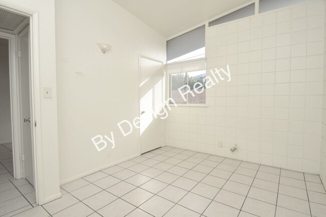 Building Photo - Sun-Drenched Mid-Century Living Near Garden District