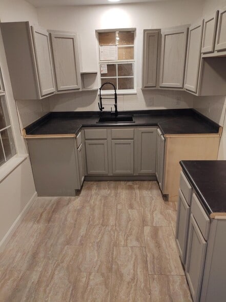 Updated kitchen with new fixtures and cabinets - 1819 Wells Station Rd