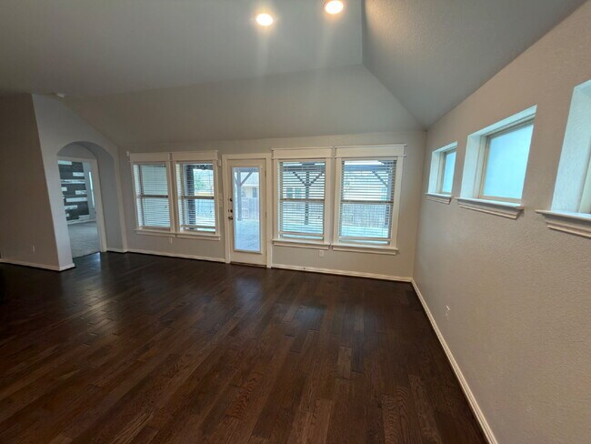 Building Photo - Four bed two bath on a corner lot with a pool in Sunfield. Gas cook top, double ovens. Open kitch...