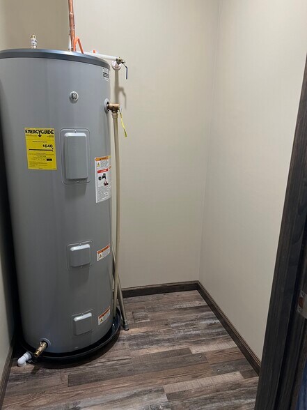 Utility closet with hot water heater - 96 Hanshew Ln