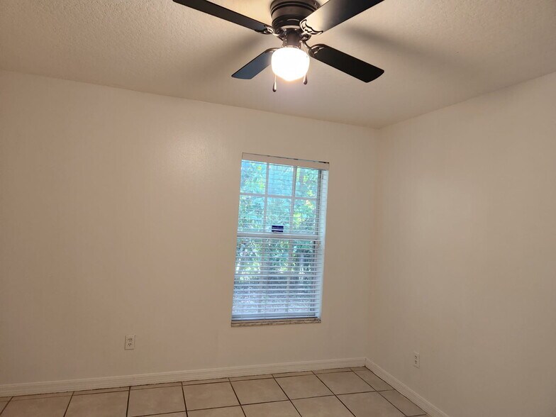 2nd bedroom new ceiling fans and closet door. - 504 13th Pl