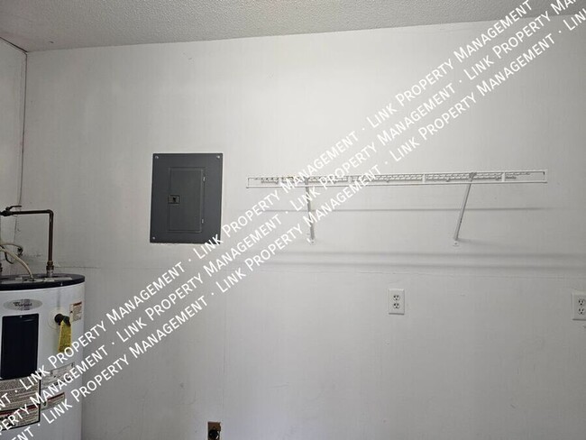 Building Photo - COMING in February, this 2 bedroom Townhom...