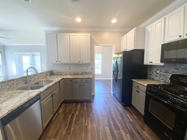 Building Photo - Three Bedroom Home with fenced-in Backyard oasis!