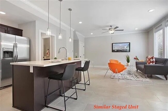 Building Photo - Stunning and Bright 3BR 2.5BA Townhome w/ 2-Car Garage • Quartzite Kitchen • Deck in Parkville