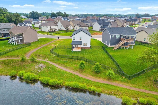 Building Photo - Stocked Pond, Walking Trails and More!!