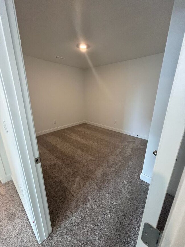 Building Photo - **BE THE LUCKY ONE TO LIVE IN THIS 2024-BUILT END-UNIT TOWNHOME IN A RESORT-STYLE COMMUNITY**