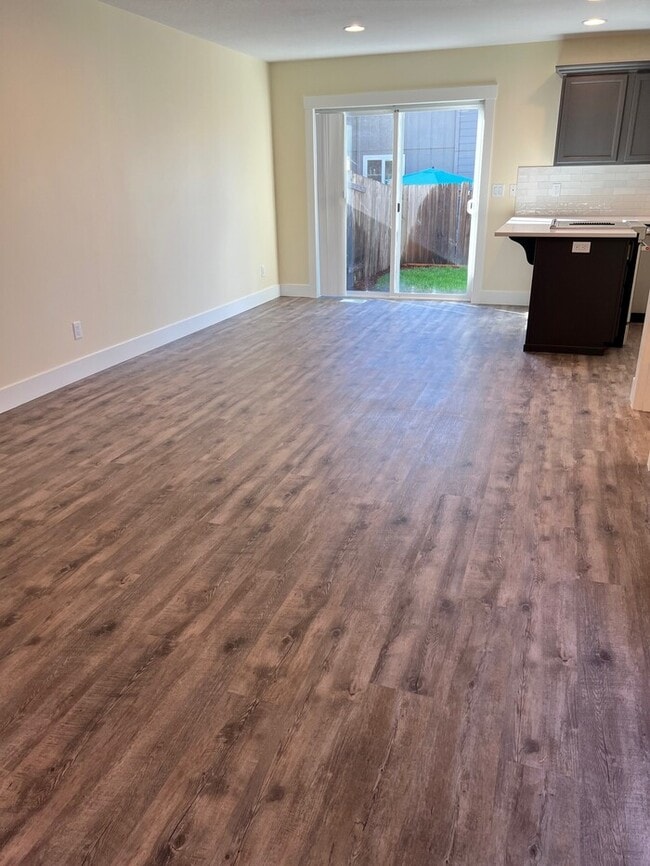 Building Photo - Remodeled Home with New Flooring, Quart Counters, W/D, Fenced Yard, Parking & MORE!