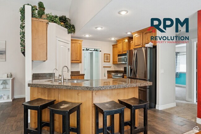Building Photo - "Spacious 6-Bed Gem with Granite Touches & Cozy Fireplace in Morgan!"