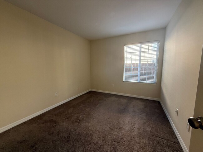 Building Photo - Upgraded Condo with Private Patio, AC, Pool, Gym, and Covered Parking in Gated Community