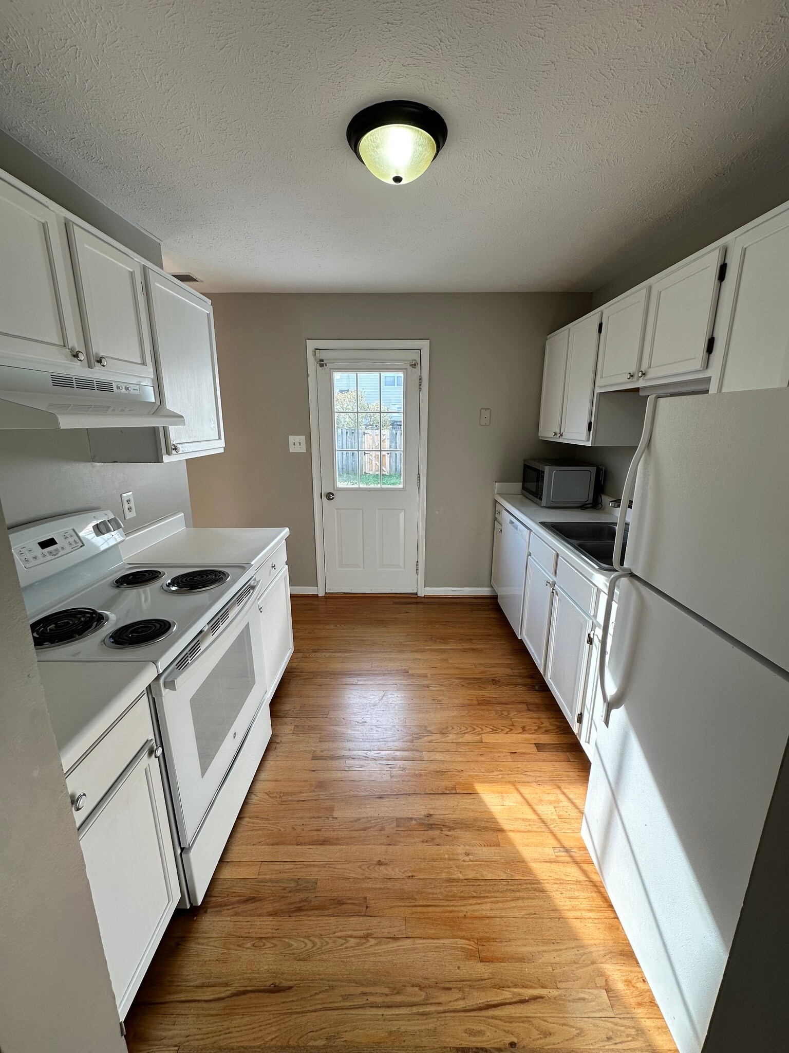 Kitchen with back yard access - 104 Barrington Ln