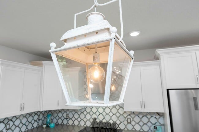 Building Photo - Introducing a captivating 3-story townhome...