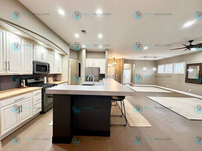 Building Photo - Open Kitchen, Expansive Living, and Covered Patio in Tranquil South Reno Near Trails, Parks & Sho...