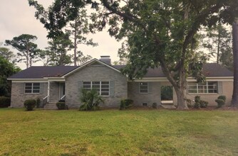 Building Photo - Spacious 3-Bedroom Brick Home with Firepla...