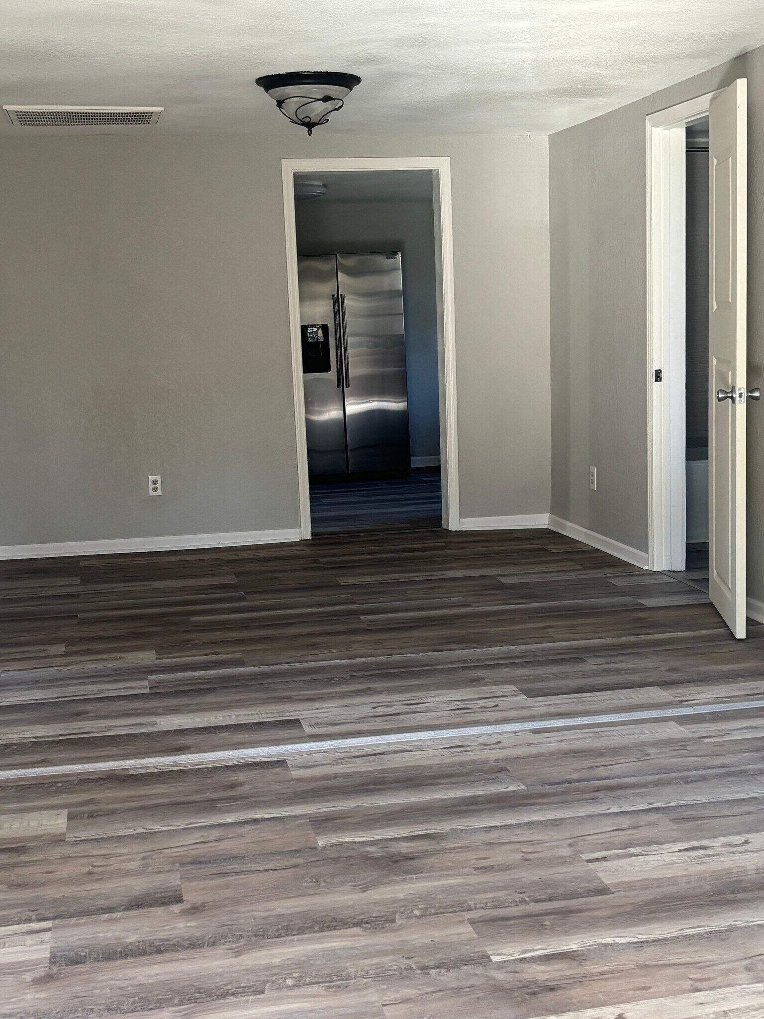 Living room with new flooring and paint - 528 France Ln