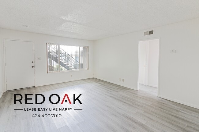 Building Photo - Sun-Drenched Two Bedroom with Hardwood Sty...