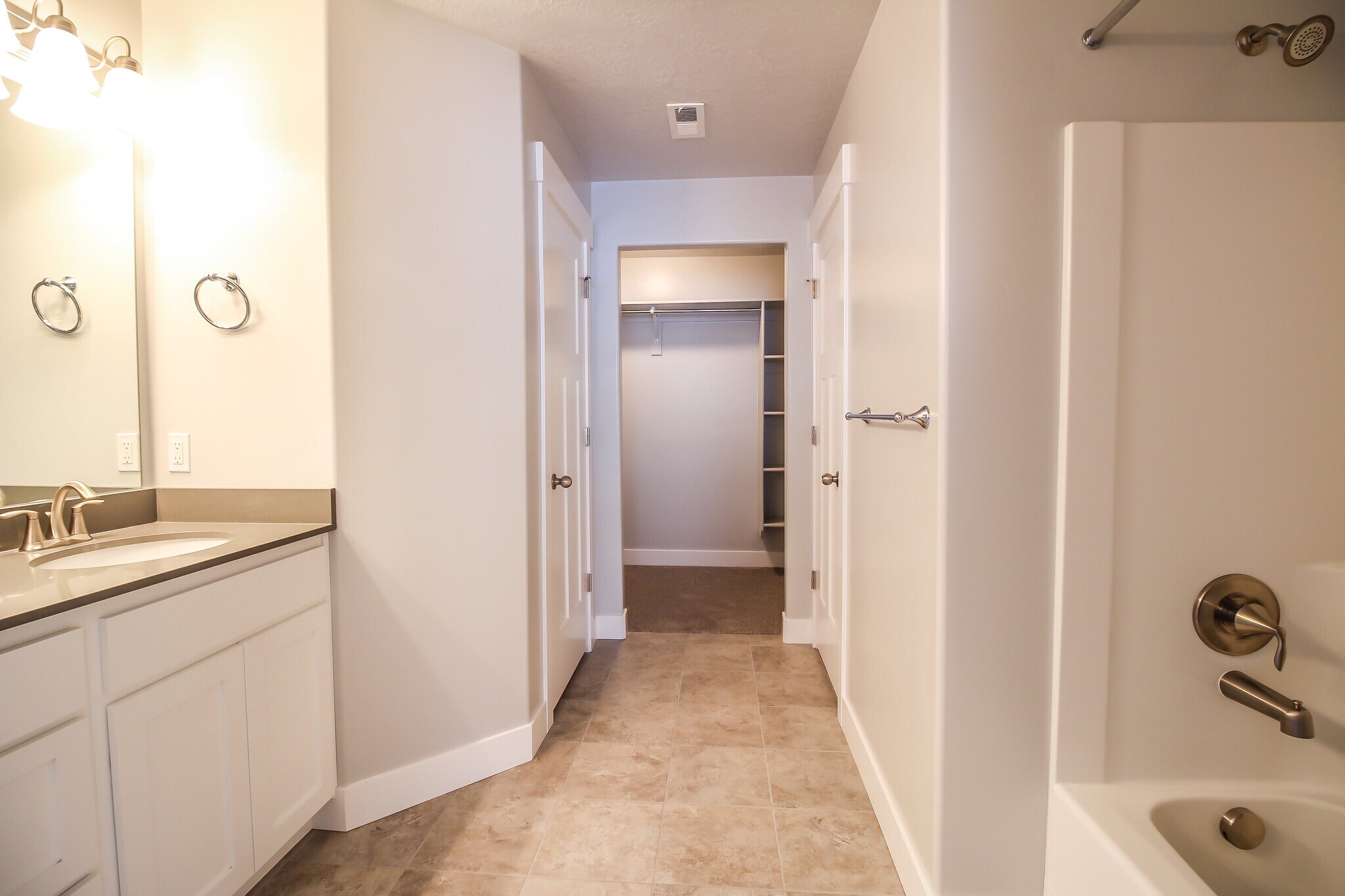 Master bathroom looking towards the master walk in closet - 4901 W Spire Way