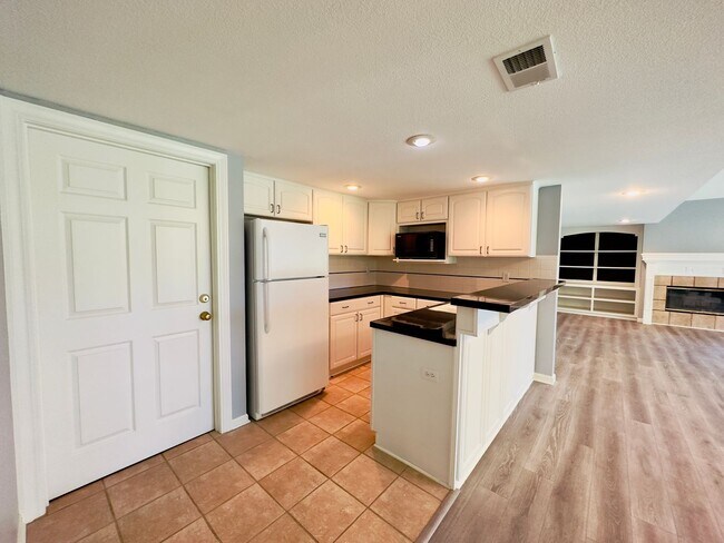 Building Photo - {6411} Enchanted Lake Estates + Updated Kitchen, Fresh Paint Throughout +  Main Floor Primary Bed...