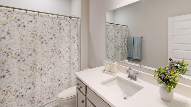 Bathroom 2. This full-sized bathroom is near the bedrooms and foyer to promote balanced living - 15580 Ruthie Lynn Dr