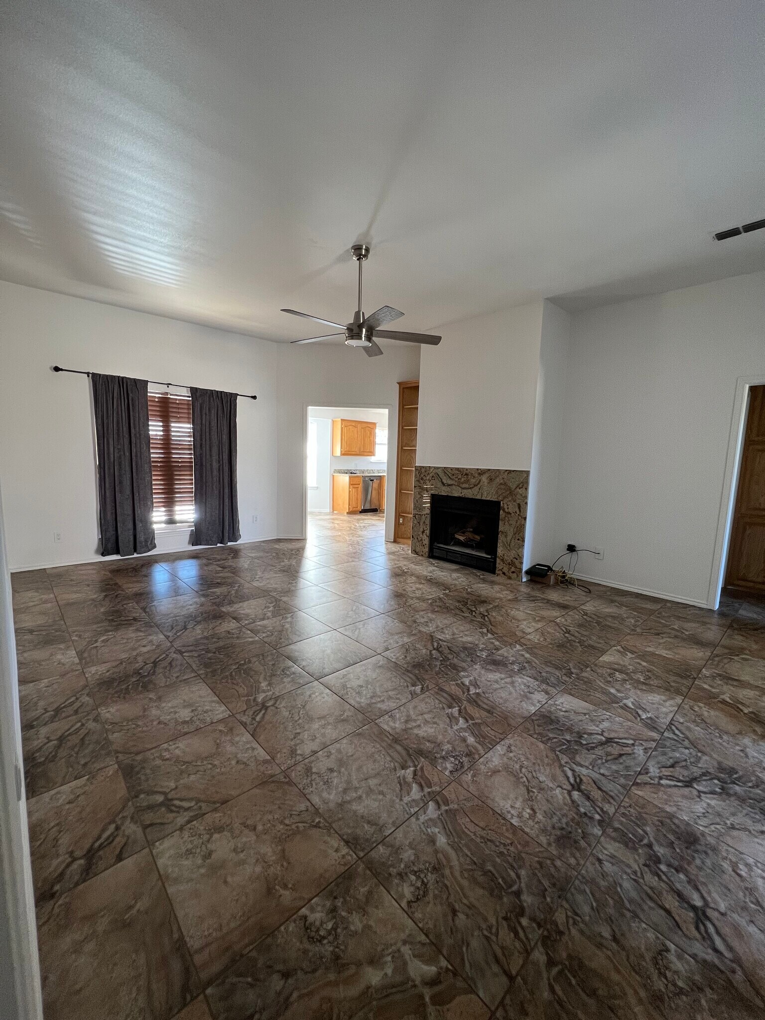 Living room with ceramic tile flooring - 8009 Thompson Pky