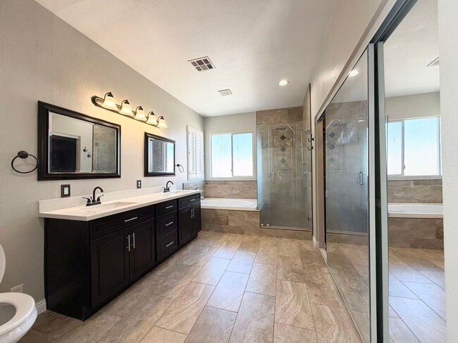 Building Photo - Wonderful corner lot home features 4 bedrooms and 3 full bathrooms