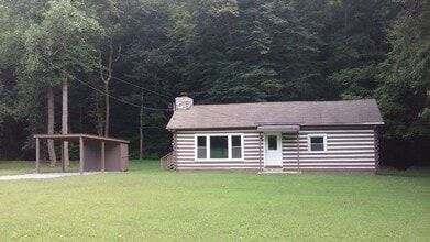 Building Photo - Cute log house in the woods off Charlotte Pike with EV charging!