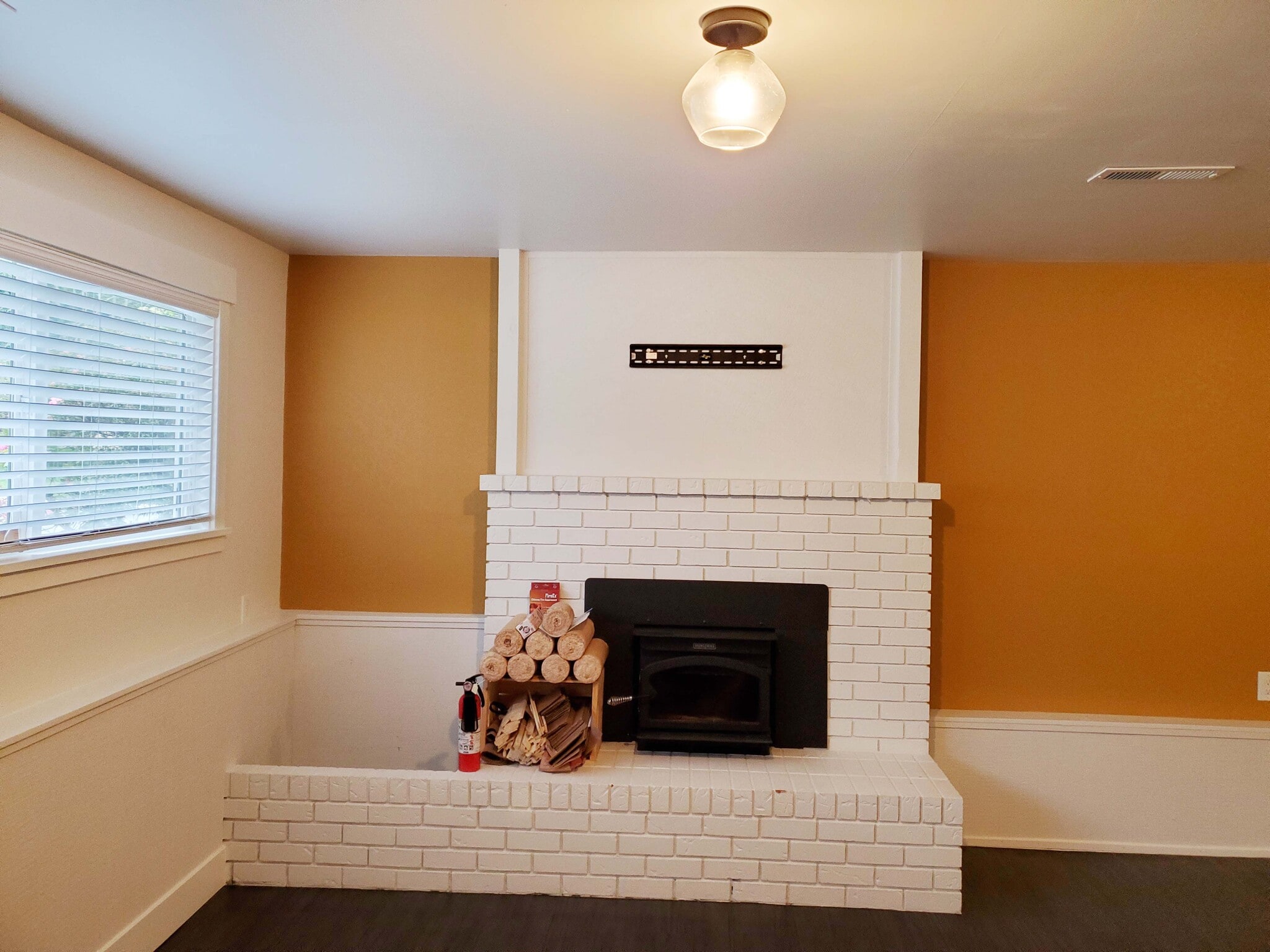 Downstairs bedroom 4 or family room with wood fireplace - 8105 Spur Ct NW