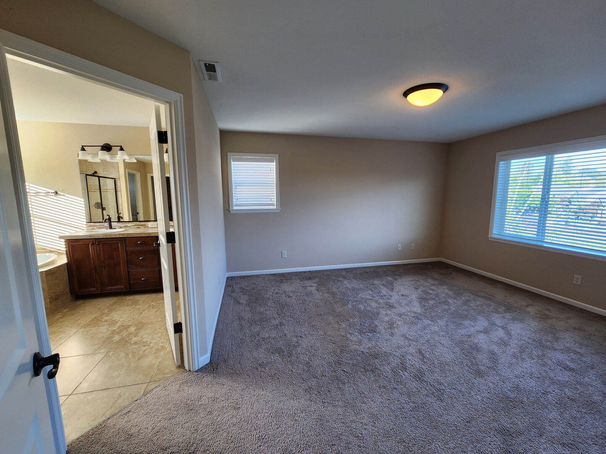Primary Bedroom on Second Floor - 6128 NW Trowbridge Dr
