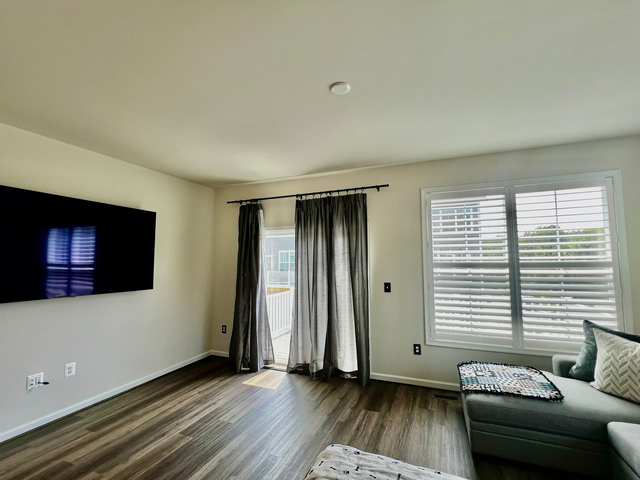 Living room and doors to deck off kitchen - 2215 Swallowtail Ln