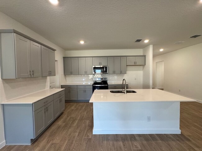 Building Photo - BRAND NEW 4 BR / 2 BA with THREE-CAR GARAG...