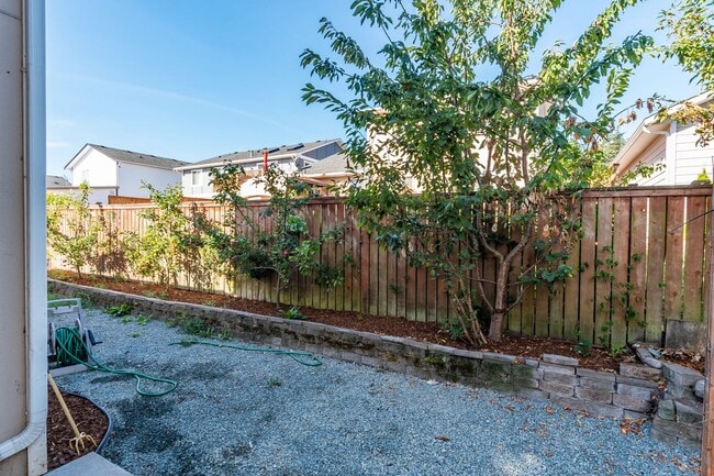 Building Photo - Spacious 4-Bedroom Home with Cozy Backyard...