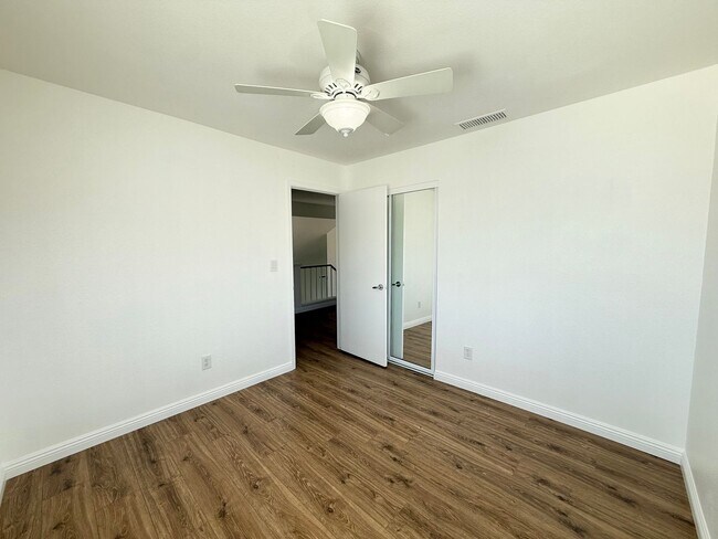 Building Photo - Corner Lot Beauty with Open Living, Guest Suite Down & Expansive Backyard