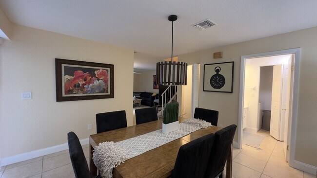 Building Photo - Spacious Wellington End-Unit Townhome | 2 Primary Suites | Screened Patio