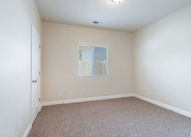 Building Photo - Four bedroom/2-bath home with 2-car garage