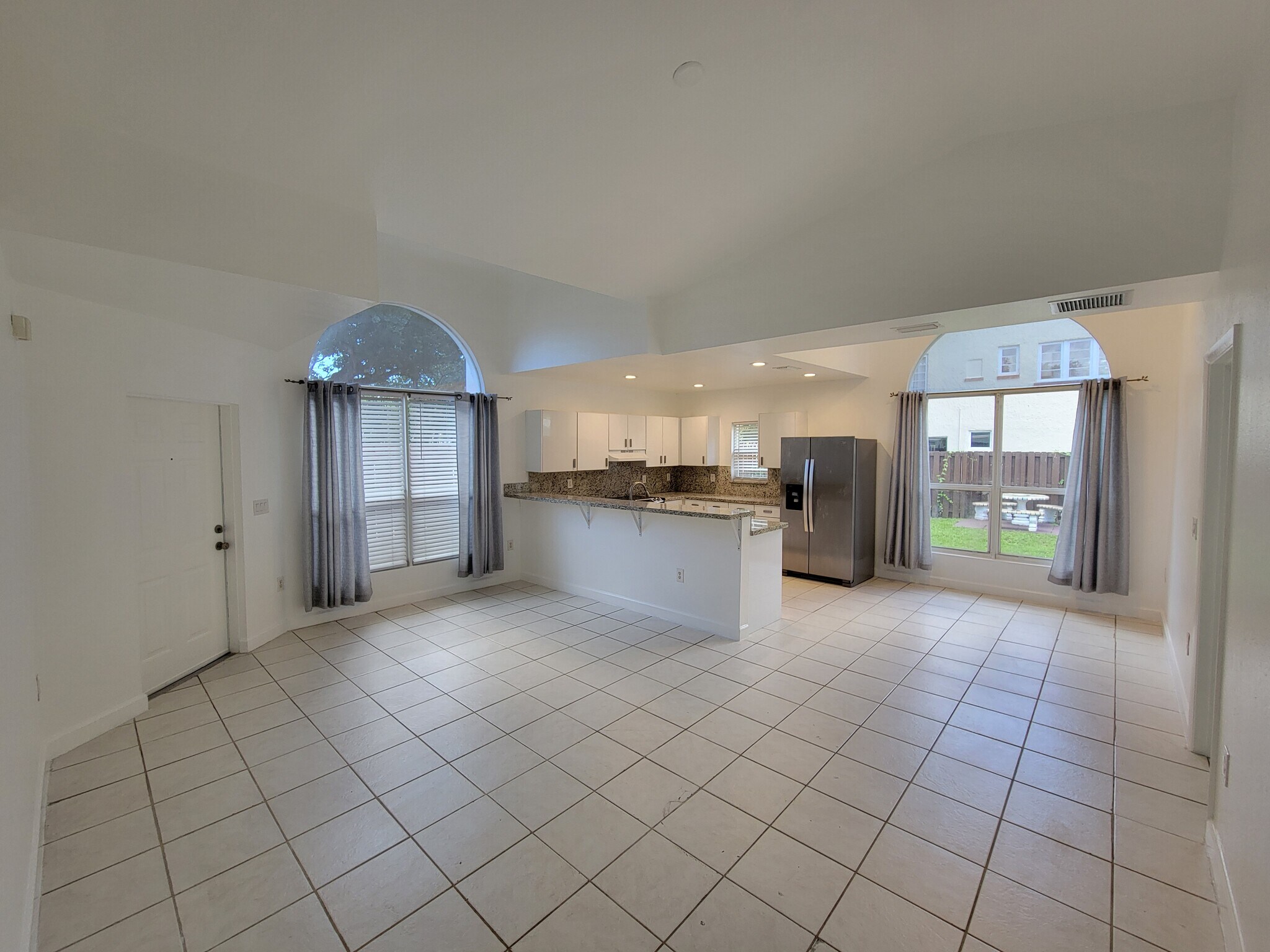 open living space with vaulted ceilings - 35 SW 7th St