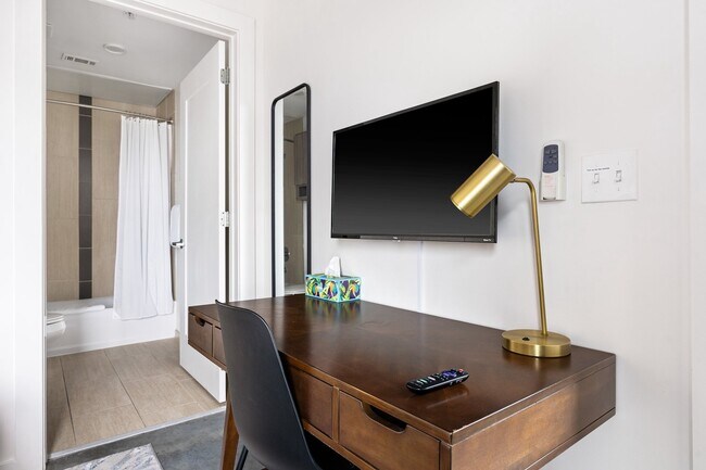 Building Photo - Midtown Magic: Big Savings + Big Perks!
