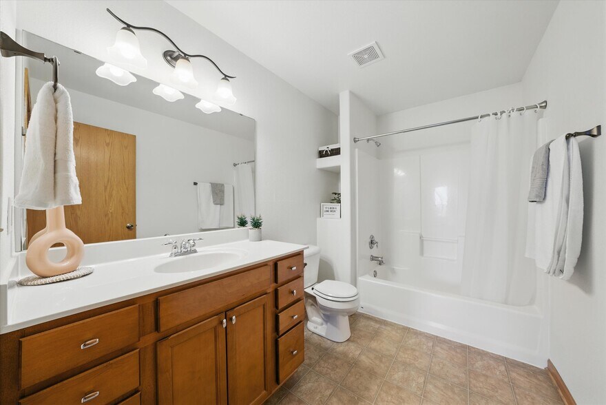 Shower over tub with tall vanity - 407 Century Oak Dr