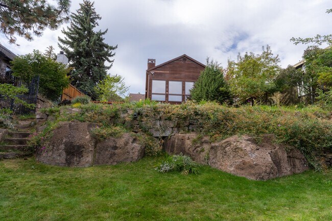 Building Photo - Private river access and stunning views from this home on Harmon Blvd! + Bonus Room