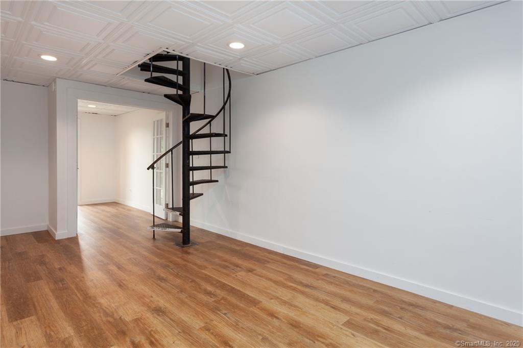 Lower level living via spiral stair case - 188 Flax Hill Rd