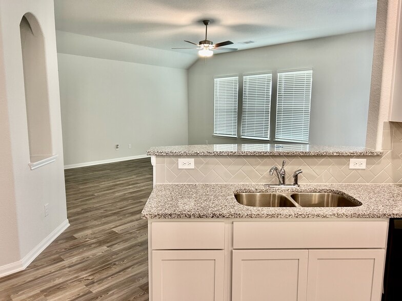 The kitchen opens up to the living area that is perfect for entertaining! - 509 Turtle Dove Dr