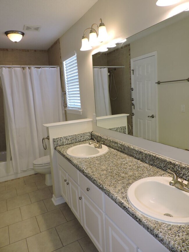 Building Photo - Easy access to shopping, interstate & Navy Federal complex!