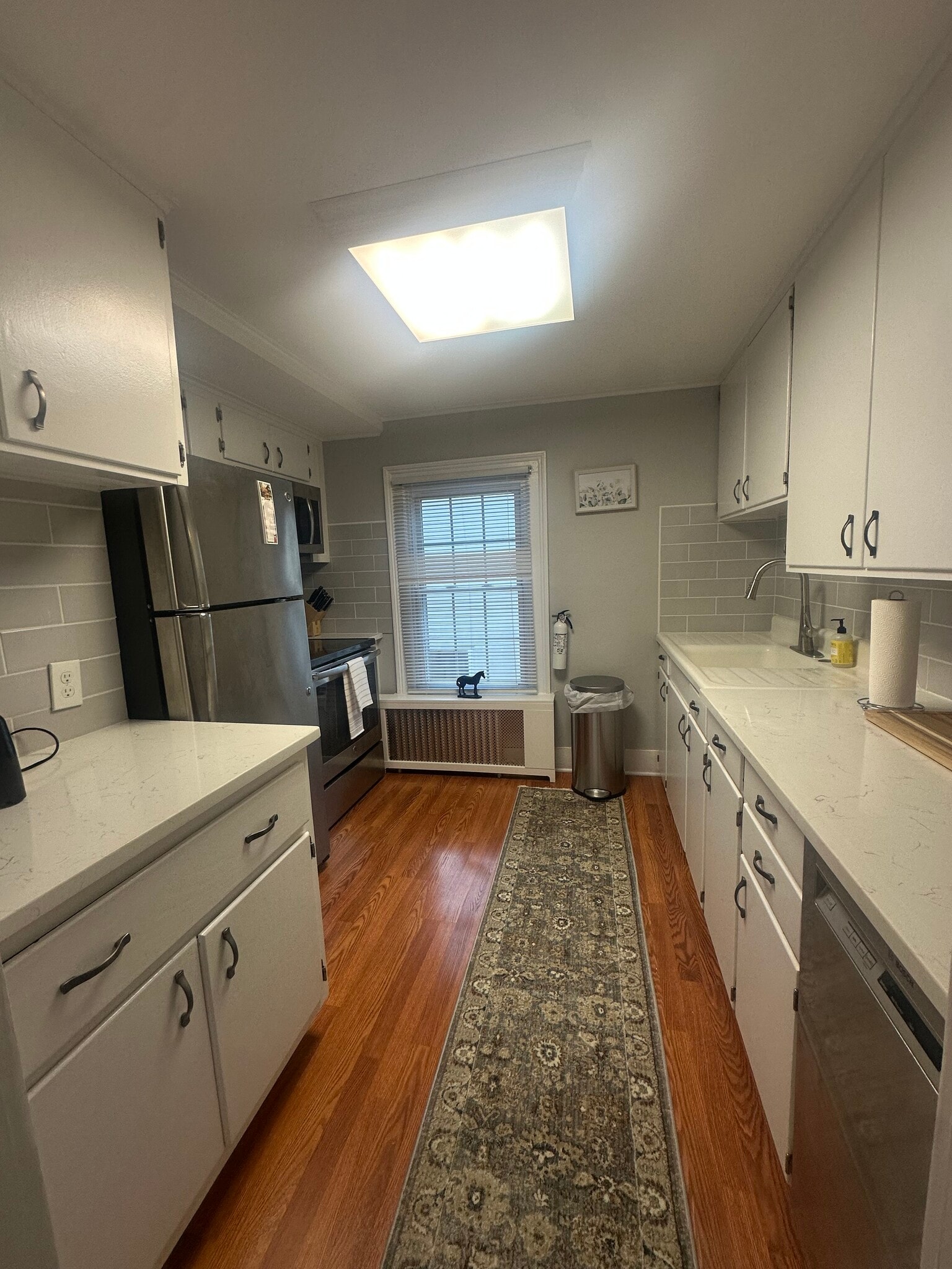 Large kitchen with quartz countertops and stainless steel fridge, oven, dishwasher, microwave - 175 Lake Ave
