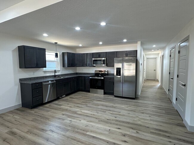 Building Photo - NEW 5 Bed 3 Bath w/ Walk Out Basement Waynesville School District