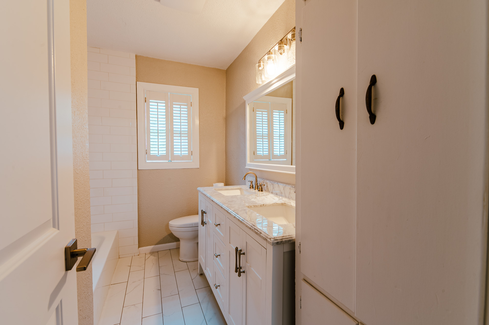 Hallway bathroom, double vanities - 3300 Medina Avenue