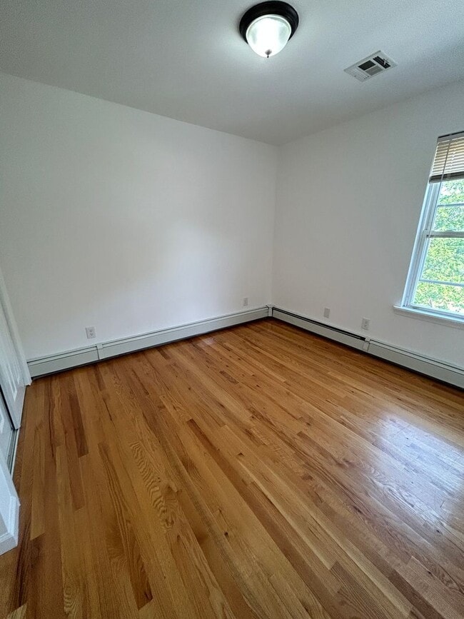 Building Photo - Discover Your Dream Home in Neptune: Spacious 4-Bedroom, 2.5-Bath with Private Backyard and Drive...