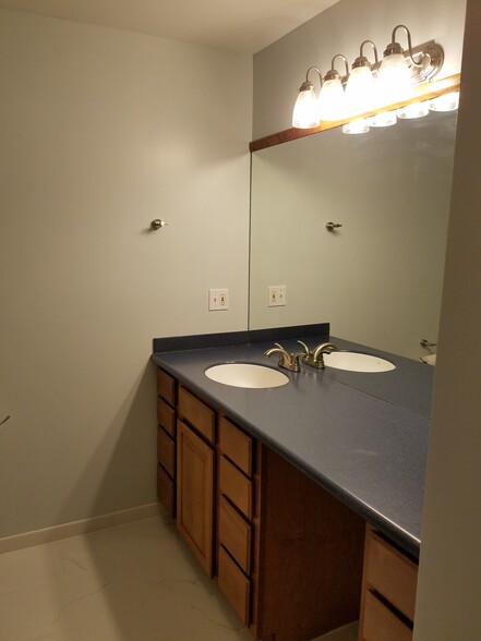 Clean updated bathroom with large vanity &amp; tiled shower! - 1901 Bodwell Rd